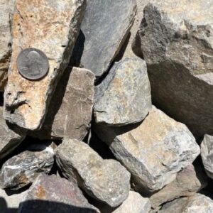 2 to 5 inch Calico Cobble with a quarter for size